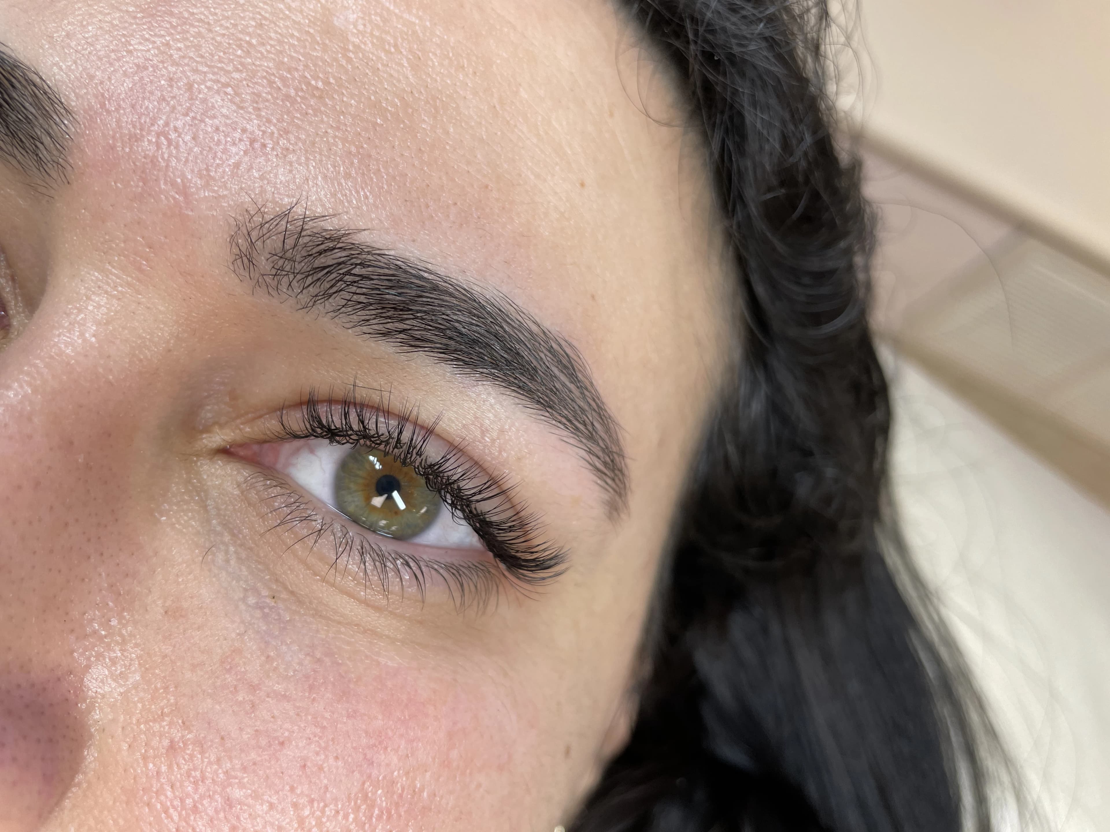Natural classic lash extensions on hazel eyes with a thick groomed brow, styled at My Beauty Space Mississauga.